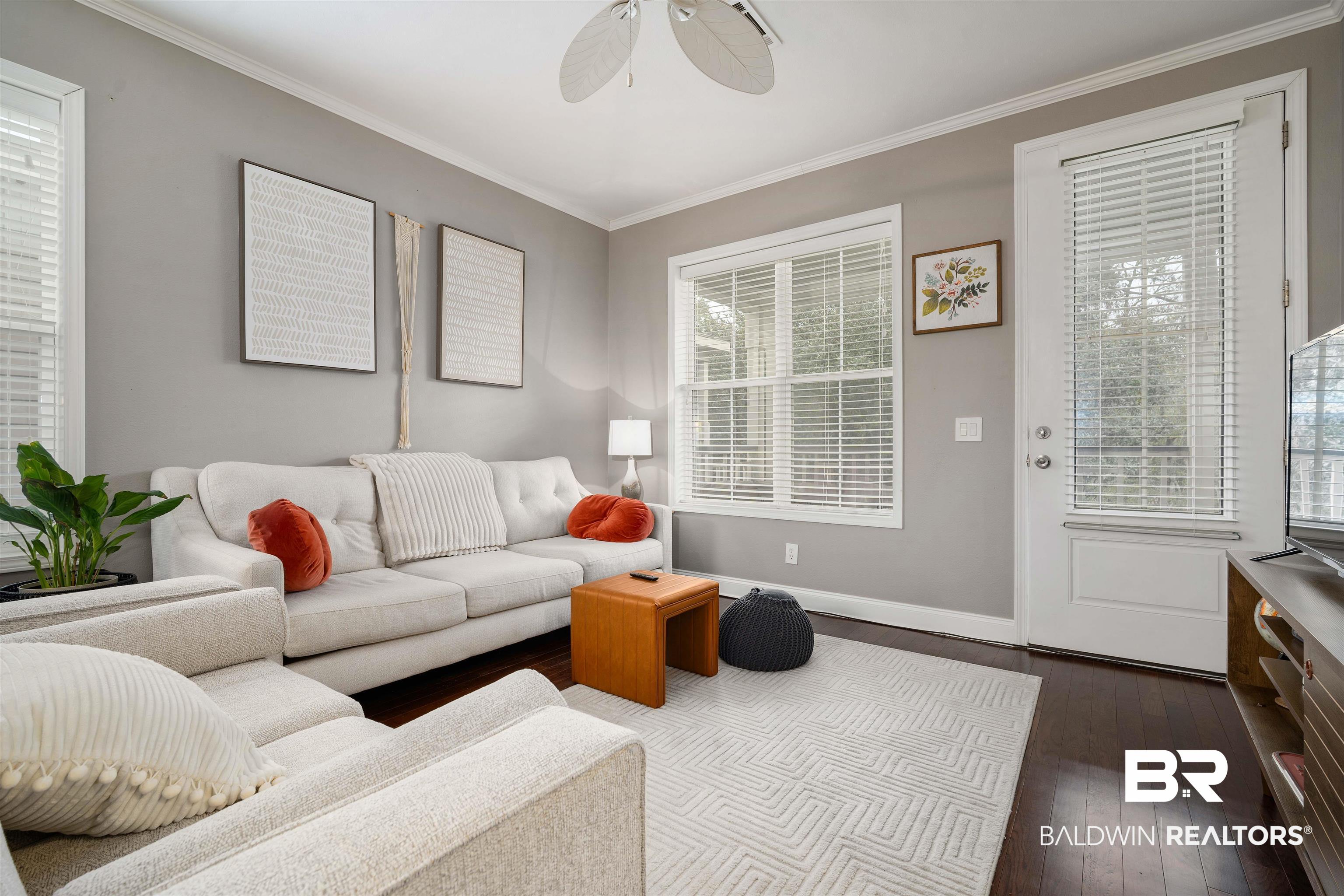25806 Pollard Road, Unit 205 Daphne, AL 36526 - Photo 4 of 26 Living area featuring dark wood-style floors, ornamental molding, and ceiling fan