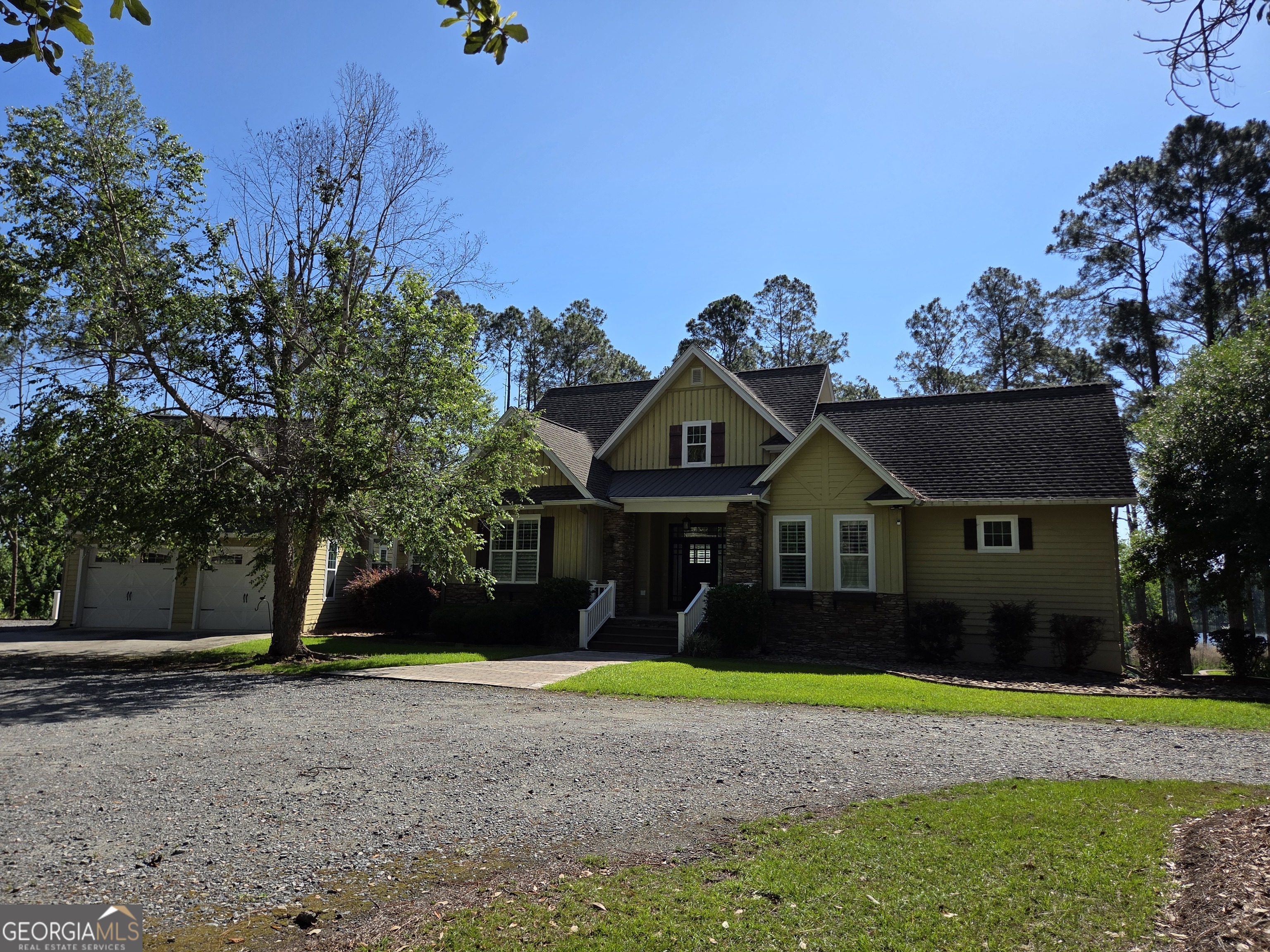 300 Hammond Powell Road Hazlehurst, GA 31539 - Photo 16 of 91 a front view of a house with a yard and garage