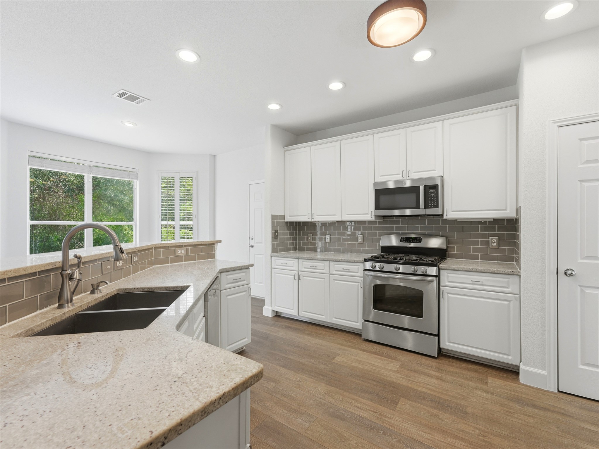 Move-in-ready with extensive updates throughout including 2025 AC units, dishwasher, microwave, fresh carpet, and a 2026 refrigerator.