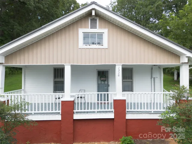 a front view of a house with a porch