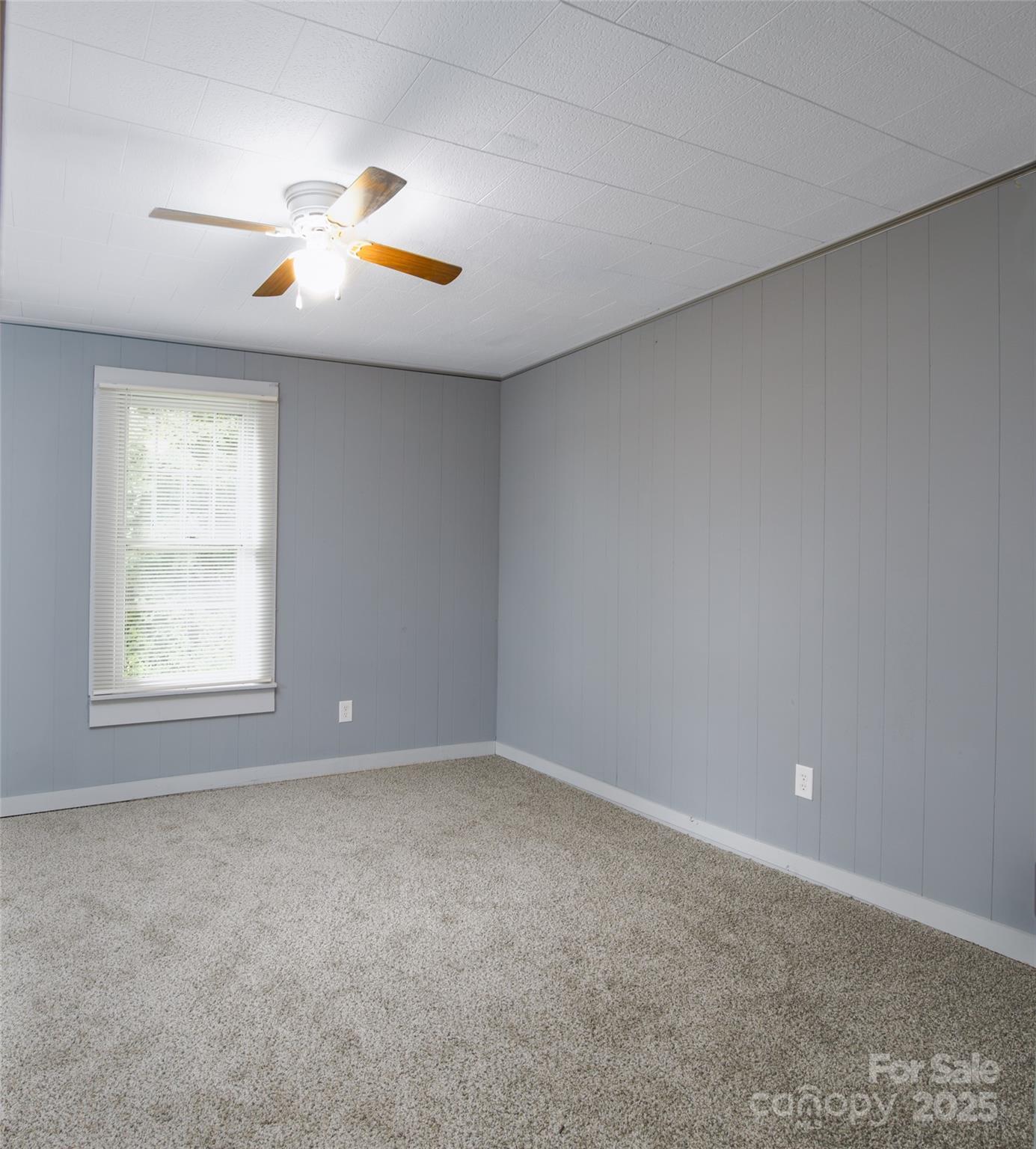 2326 Morganton Boulevard Southwest Lenoir, NC 28645 - Photo 23 of 34 an empty room with window and chandelier fan