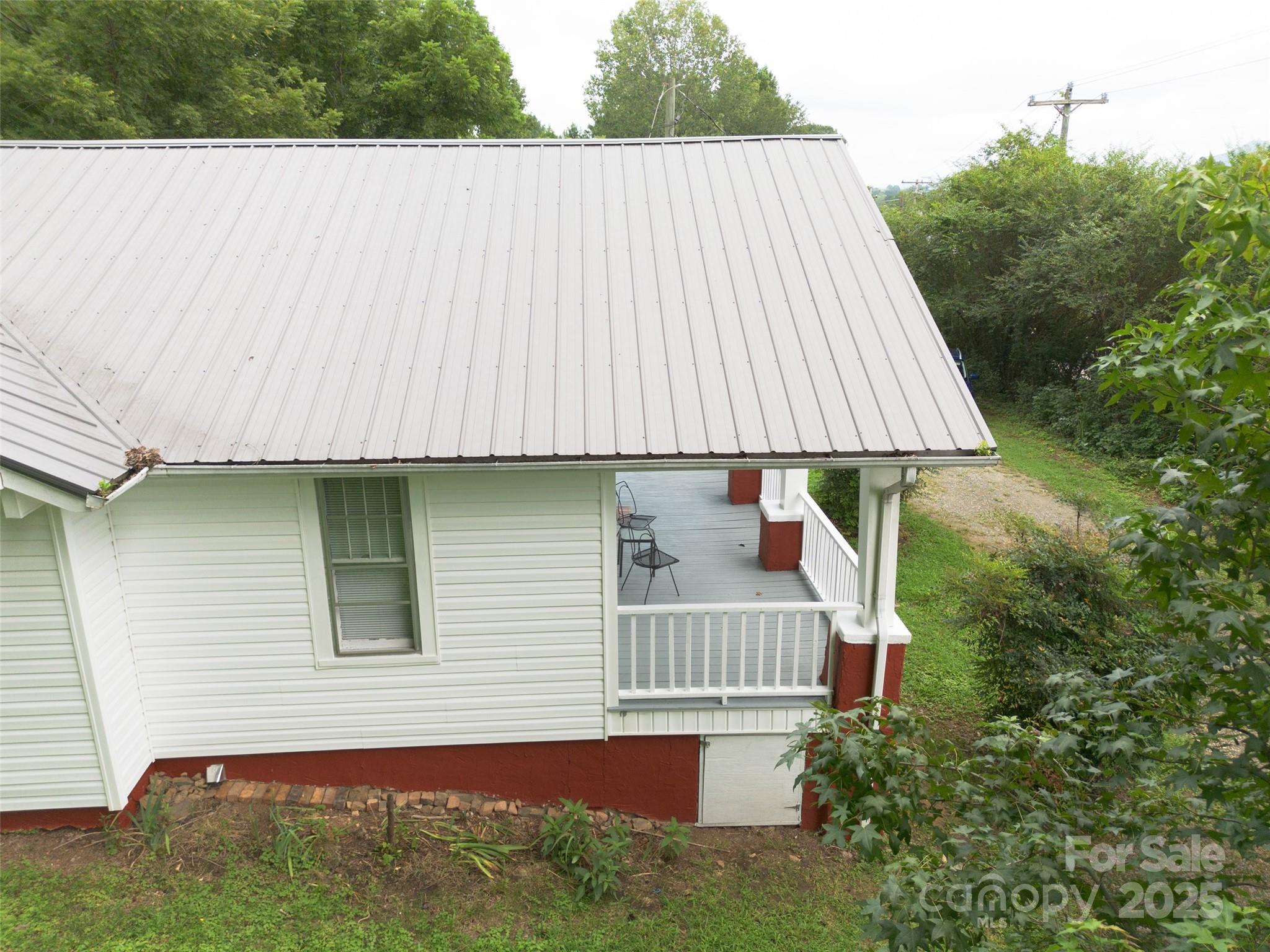 2326 Morganton Boulevard Southwest Lenoir, NC 28645 - Photo 28 of 34 a aerial view of a house with a yard and deck
