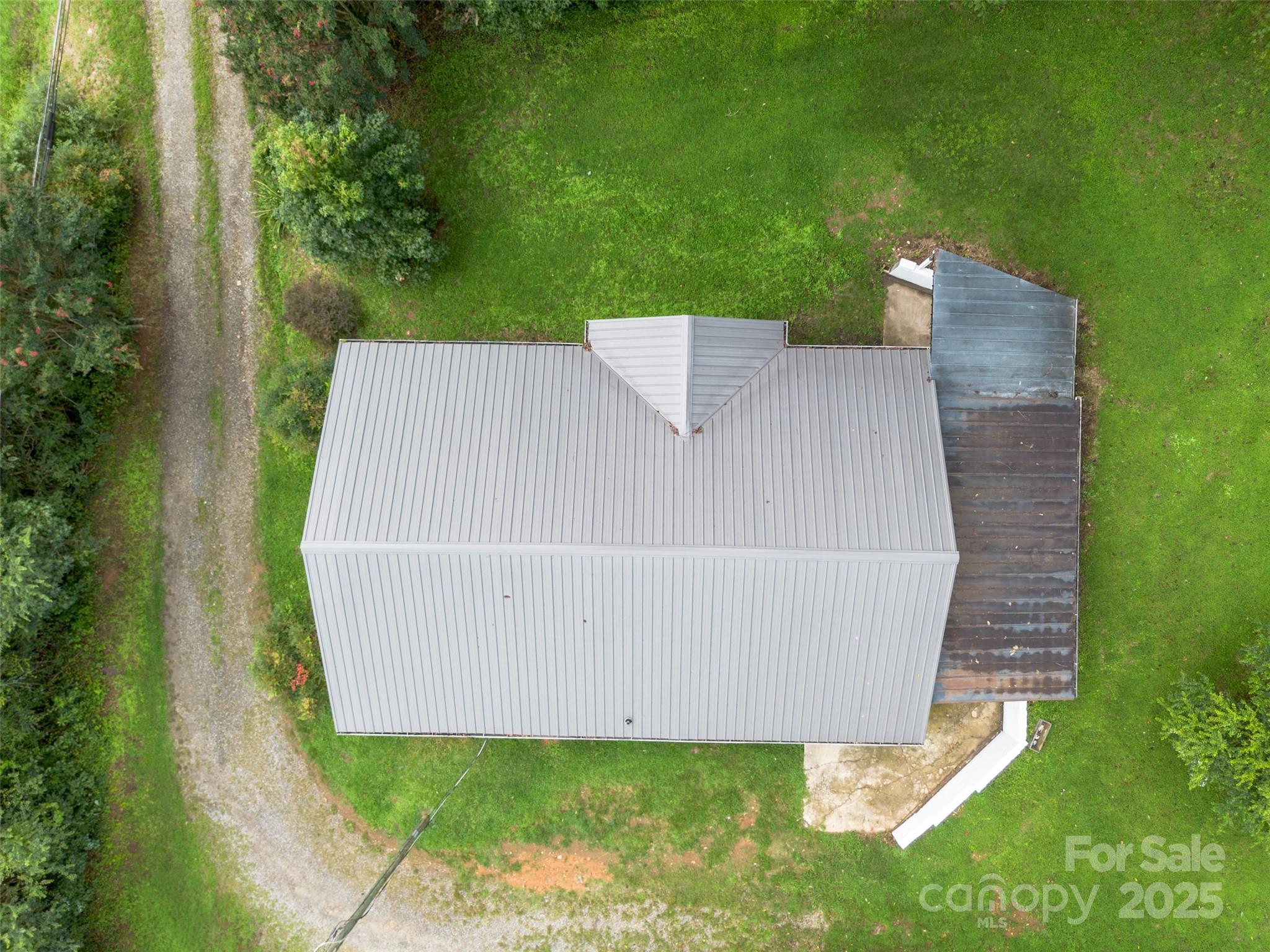 2326 Morganton Boulevard Southwest Lenoir, NC 28645 - Photo 32 of 34 an aerial view of a house with a yard