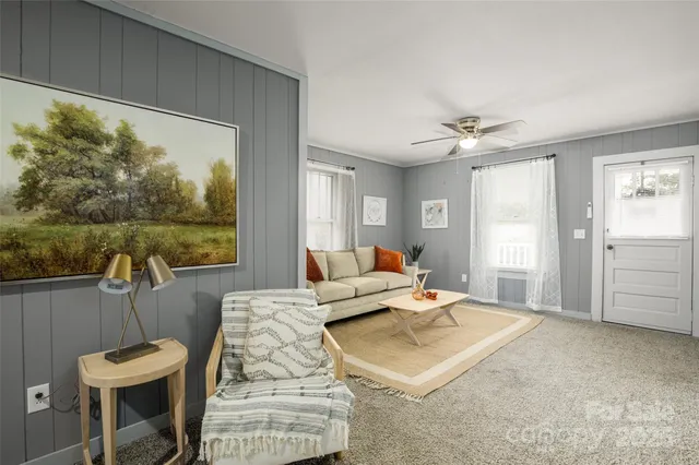 a living room with furniture and a window