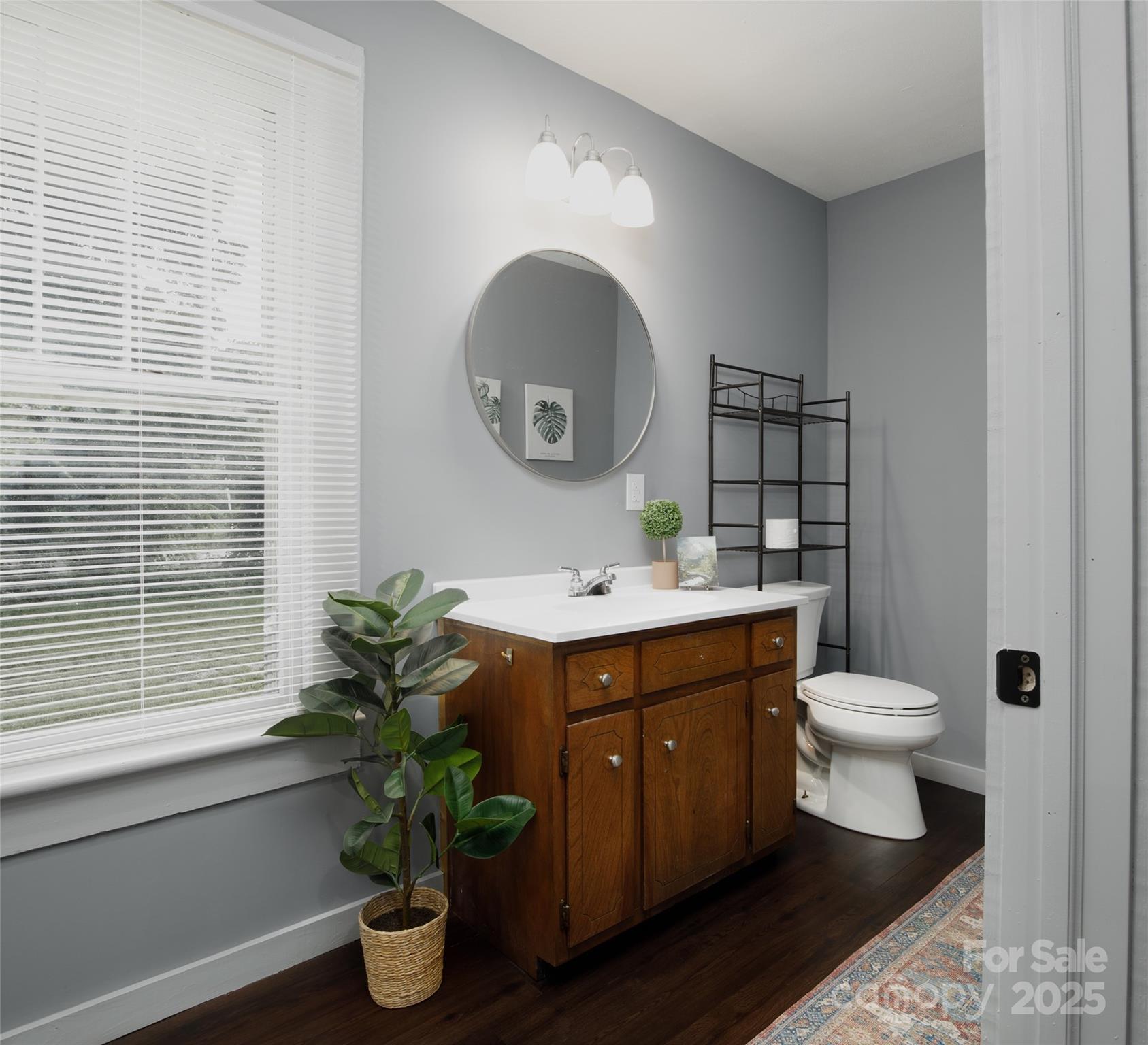 2326 Morganton Boulevard Southwest Lenoir, NC 28645 - Photo 10 of 34 a bathroom with a toilet a sink and a mirror
