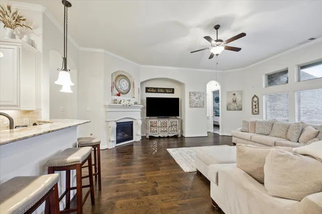 a living room with furniture fireplace and a flat screen tv