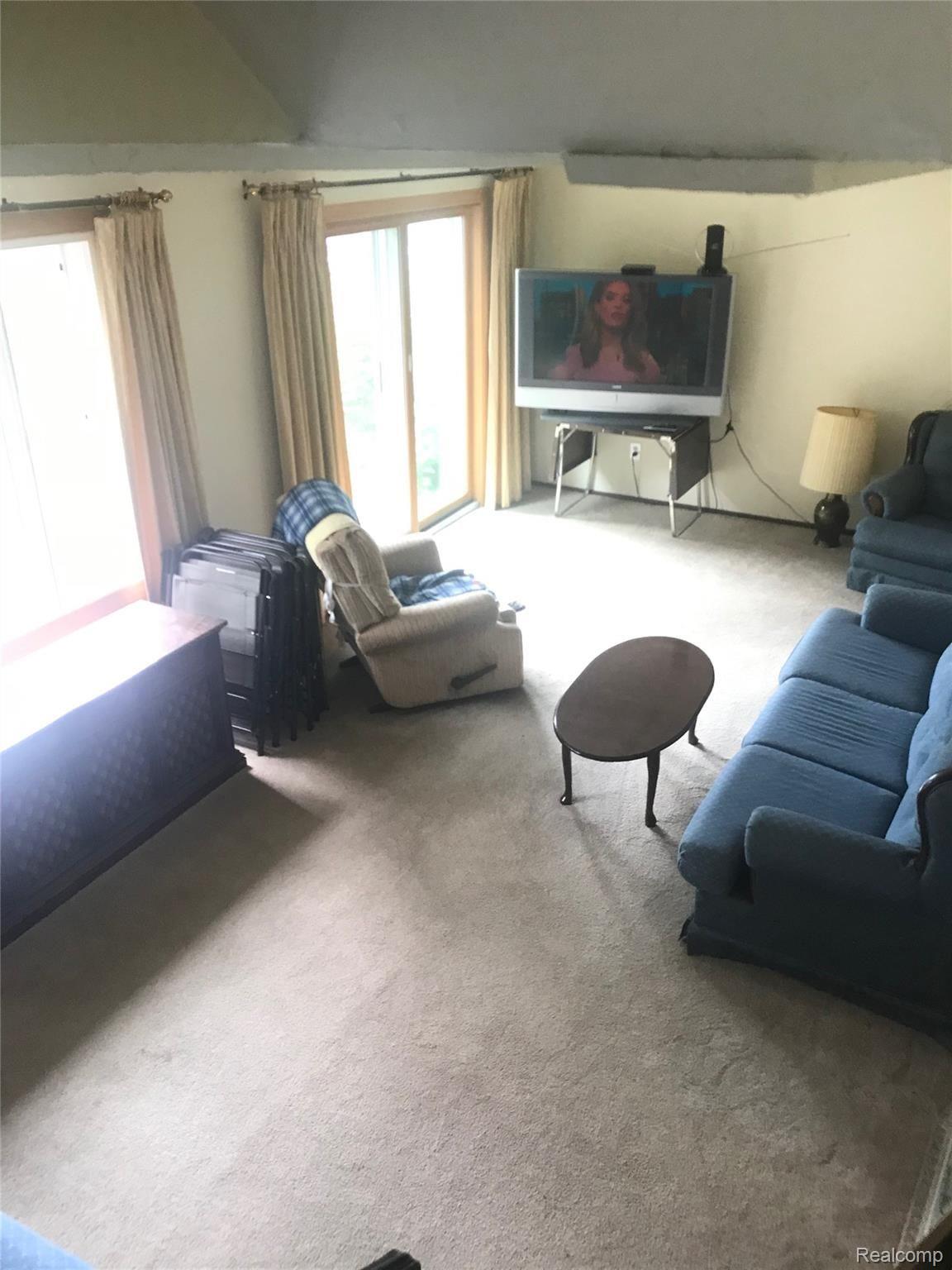 7015 Hatchery Road Waterford, MI 48327 - Photo 10 of 21 Living room with doorway to patio