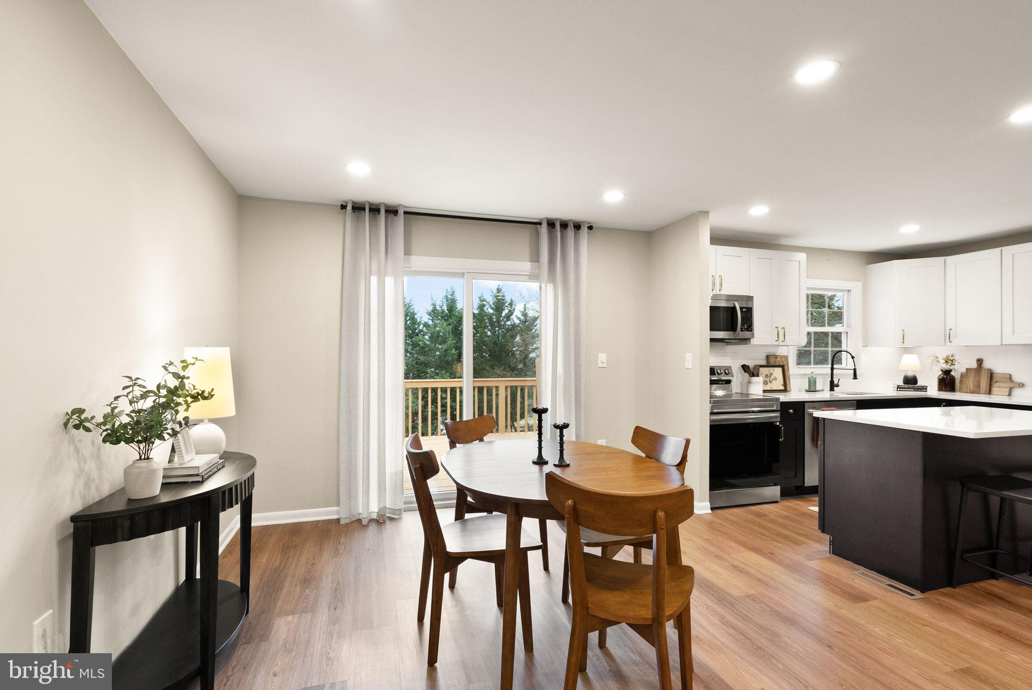 12412 Needle Drive Clarksburg, MD 20871 - Photo 51 of 51 a kitchen with a table and chairs in it