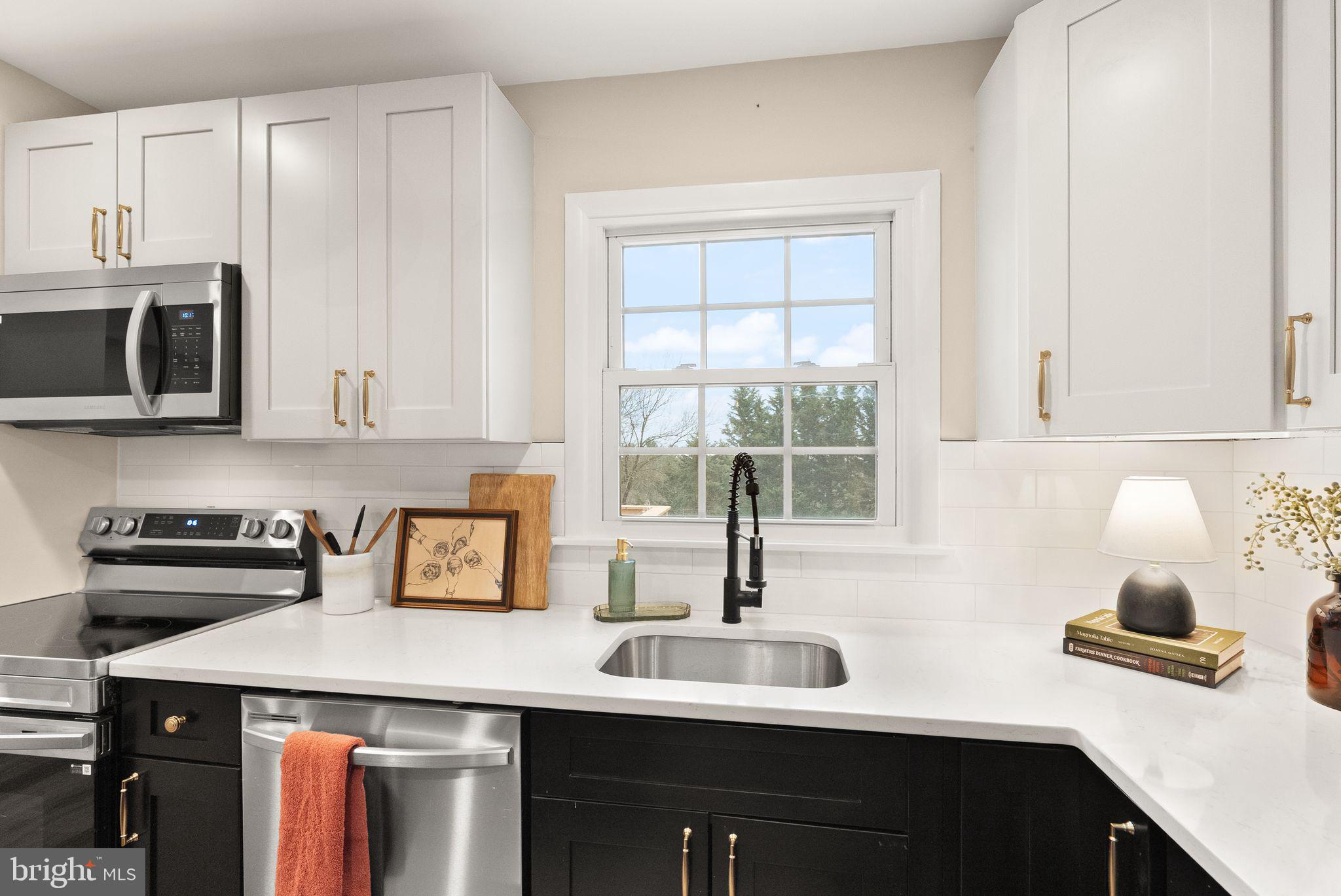 12412 Needle Drive Clarksburg, MD 20871 - Photo 9 of 51 a kitchen with a sink and cabinets