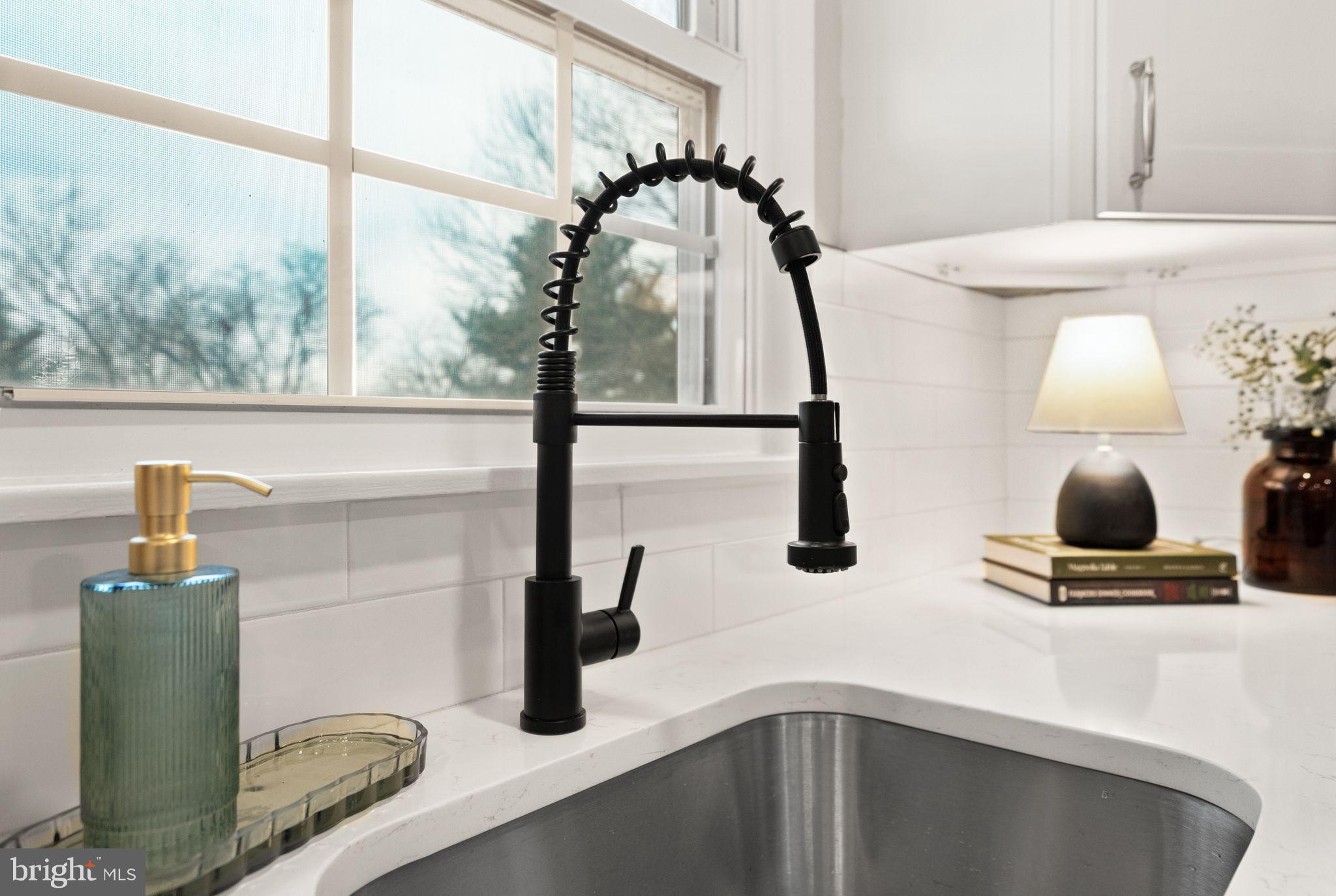 12412 Needle Drive Clarksburg, MD 20871 - Photo 11 of 51 a kitchen with a sink and a mirror