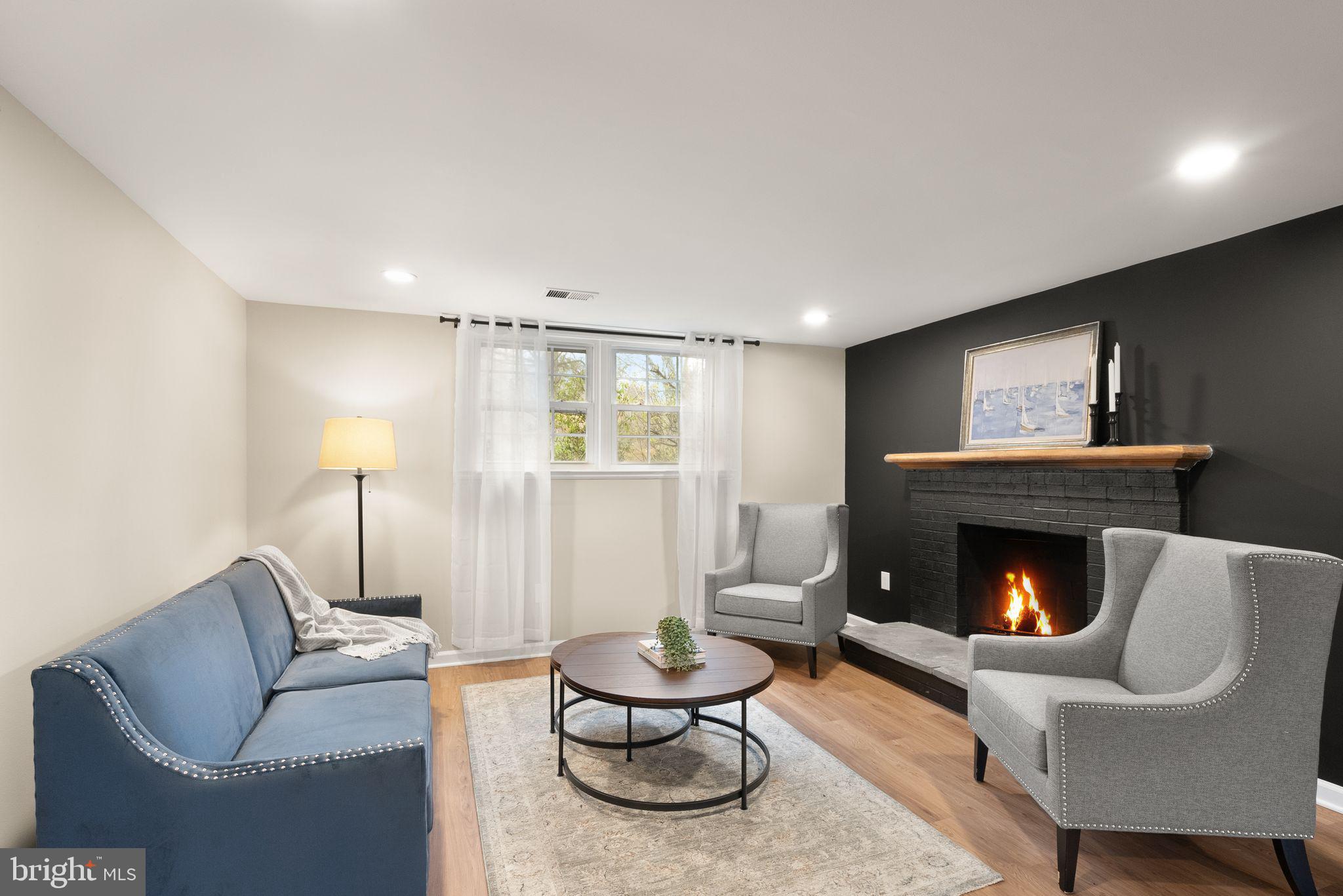 12412 Needle Drive Clarksburg, MD 20871 - Photo 25 of 51 a living room with furniture and a fireplace