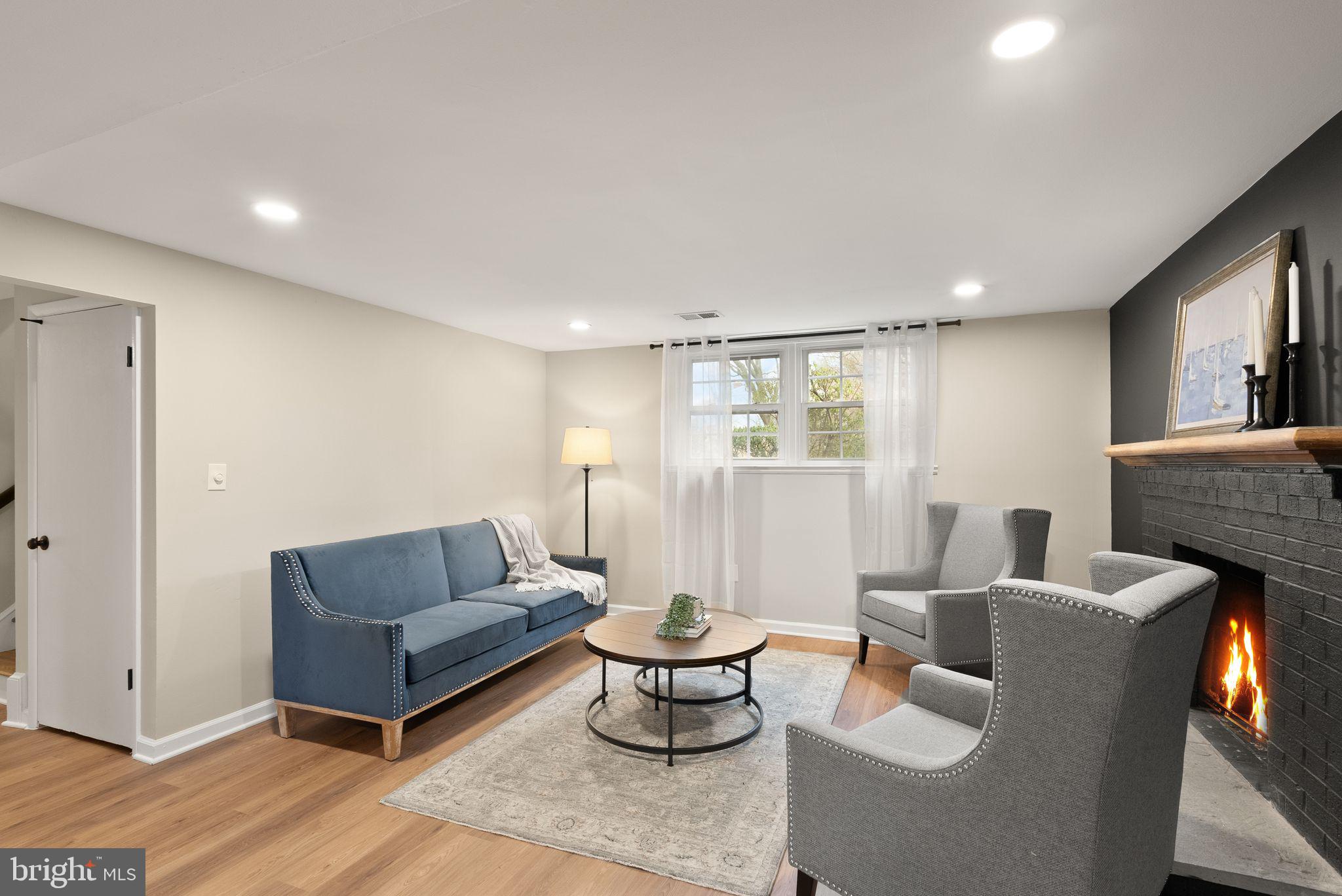 12412 Needle Drive Clarksburg, MD 20871 - Photo 26 of 51 a living room with furniture and a dining table with rug