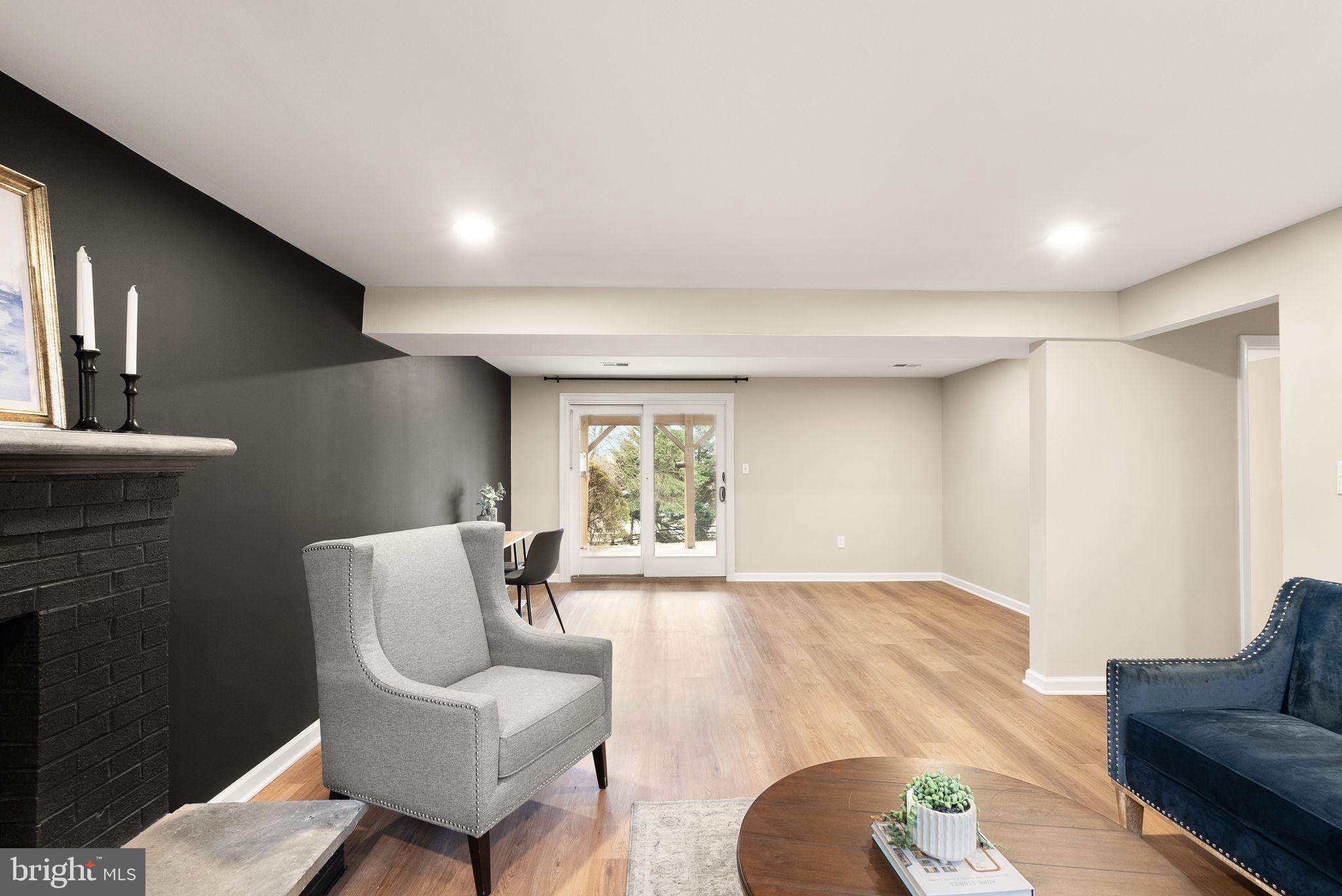 12412 Needle Drive Clarksburg, MD 20871 - Photo 27 of 51 a living room with furniture and a large window
