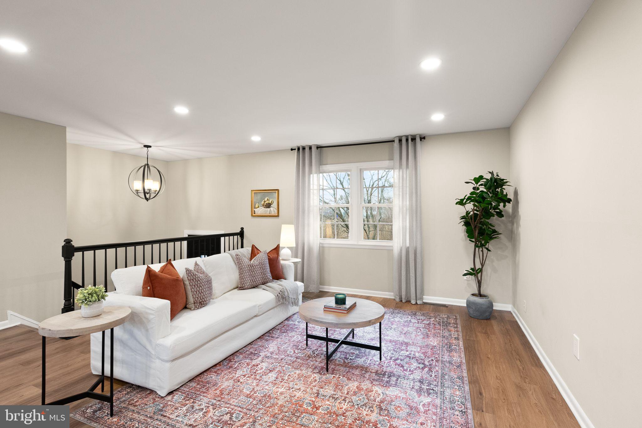12412 Needle Drive Clarksburg, MD 20871 - Photo 46 of 51 a living room with furniture and a potted plant