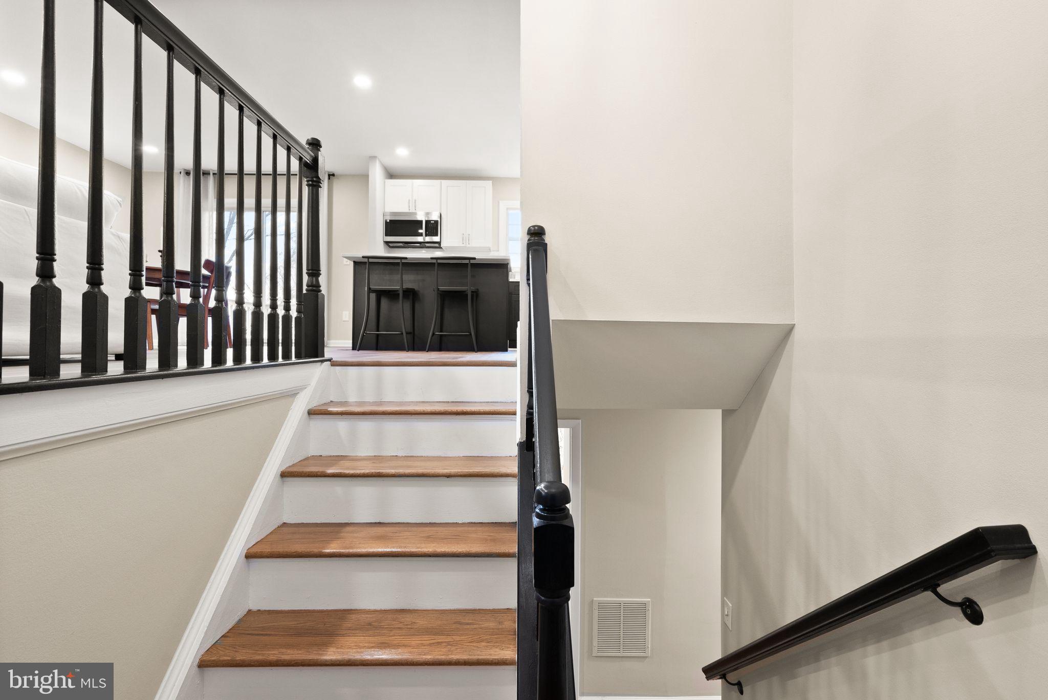 12412 Needle Drive Clarksburg, MD 20871 - Photo 6 of 51 a view of entryway and hall with wooden floor
