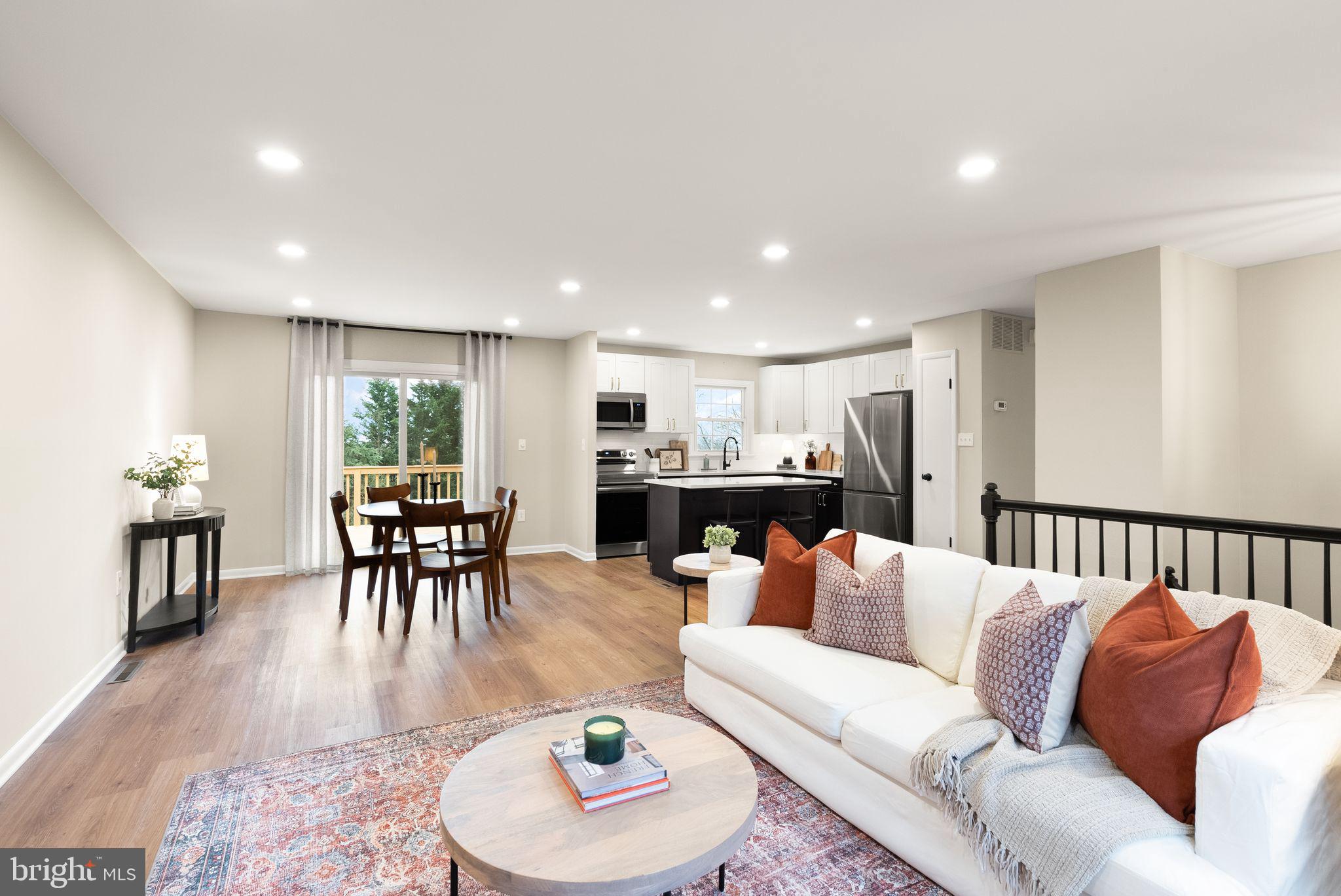 12412 Needle Drive Clarksburg, MD 20871 - Photo 48 of 51 a living room with furniture kitchen and a table