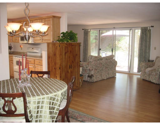 47 Ruthellen Road Chelmsford, MA 01824 - Photo 3 of 15 a living room with furniture and a floor to ceiling window
