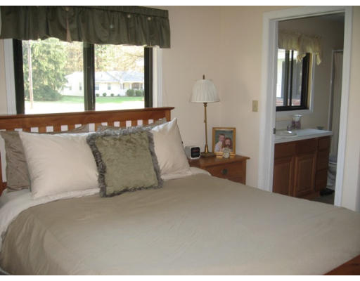 47 Ruthellen Road Chelmsford, MA 01824 - Photo 8 of 15 a bedroom with a large bed and a window