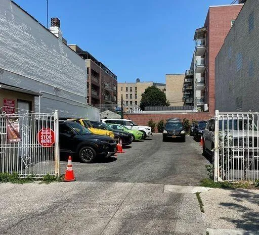 a view of street with parked cars