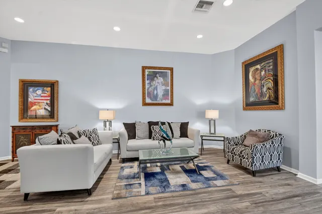 a kitchen with granite countertop a sink and a stove top oven