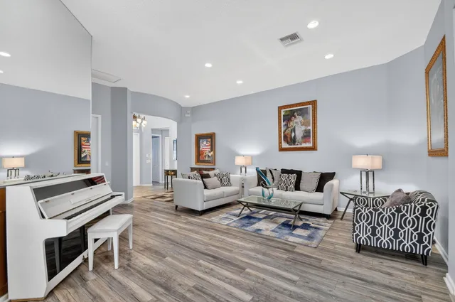 a kitchen with stainless steel appliances granite countertop a sink and a stove
