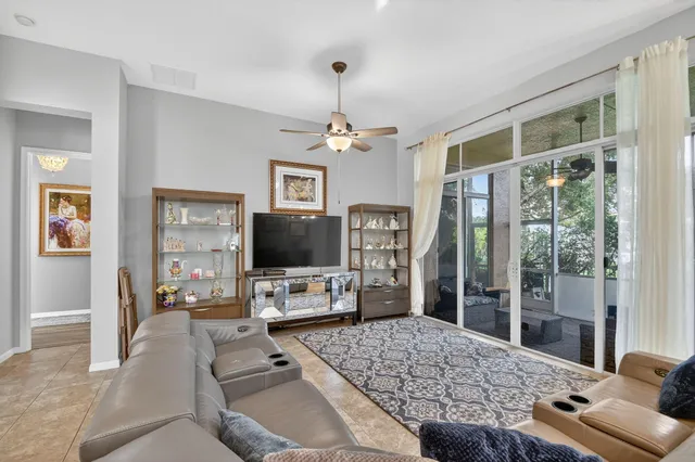 a bathroom with a toilet a sink and a window