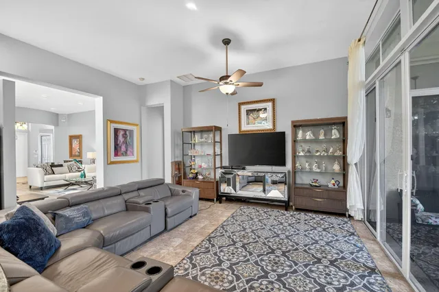 a bathroom with a sink mirror and a toilet