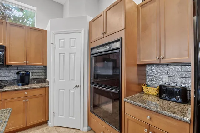 a outdoor living space with furniture and a floor to ceiling window