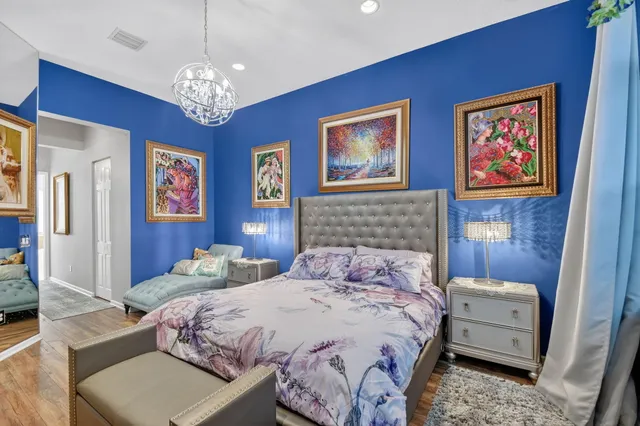 an aerial view of residential house with outdoor space and trees all around