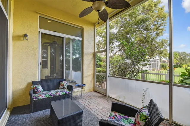 a view of a house with swimming pool and sitting area