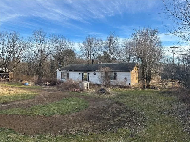 a house view with a backyard space