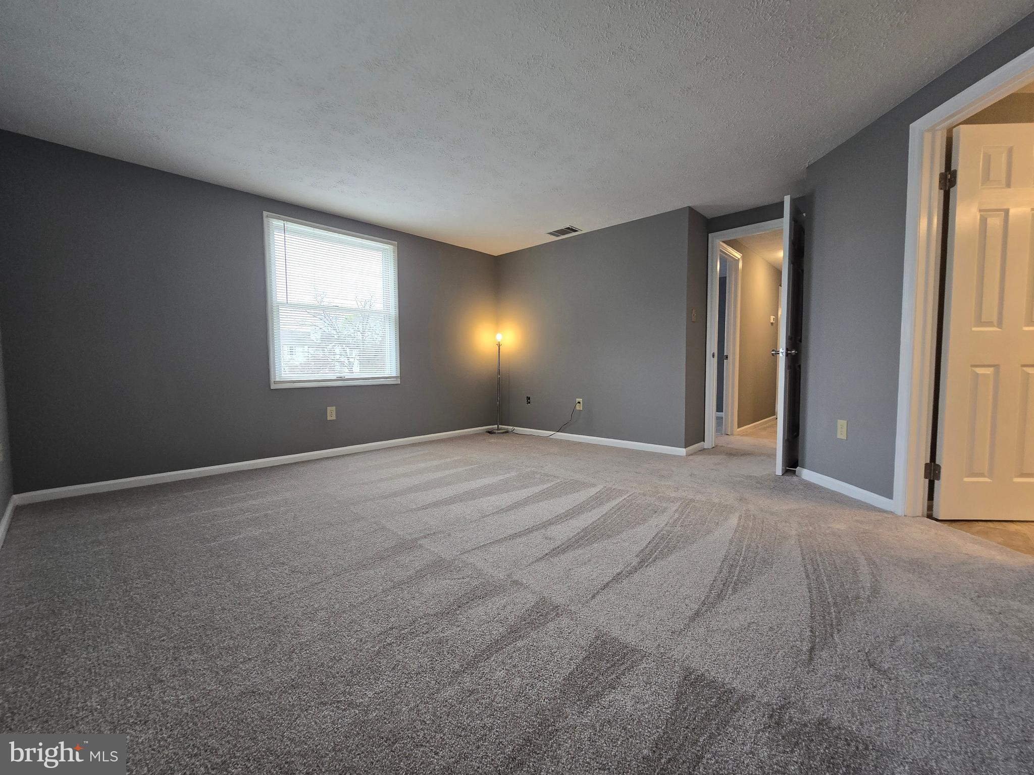 821 Stratford Way, Unit H Frederick, MD 21701 - Photo 27 of 45 a view of an empty room with a window