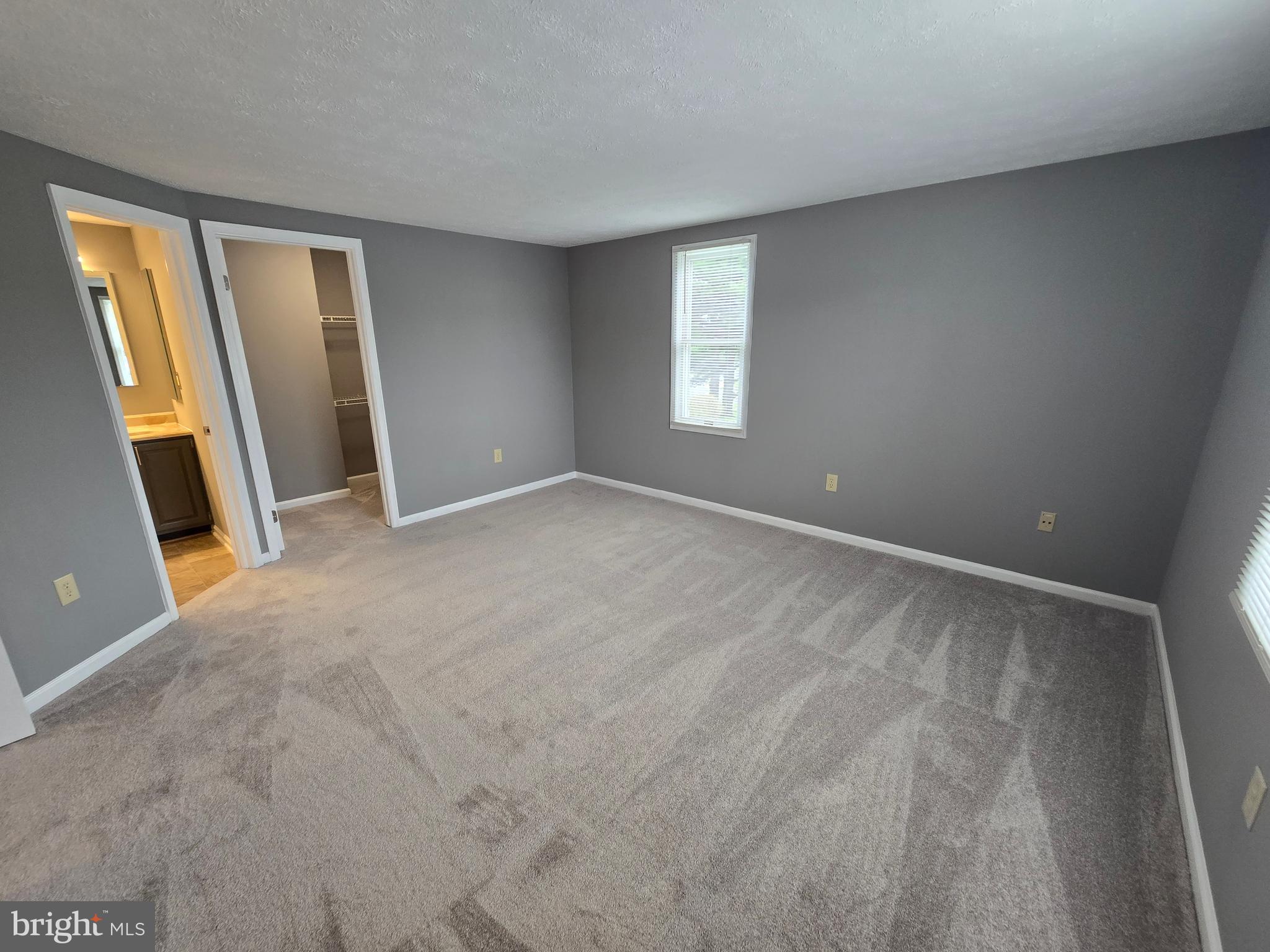 821 Stratford Way, Unit H Frederick, MD 21701 - Photo 30 of 45 a view of an empty room with a window
