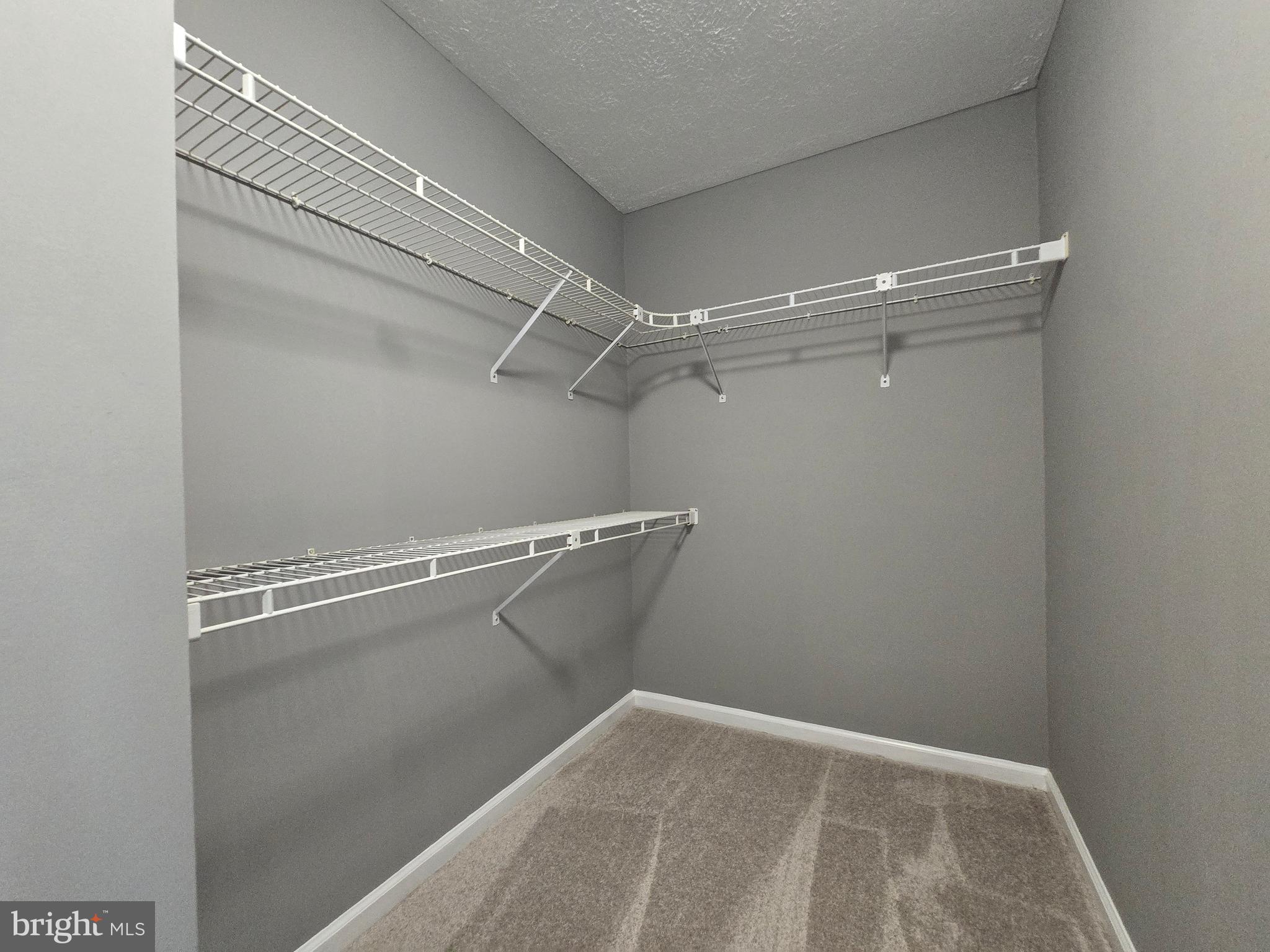 821 Stratford Way, Unit H Frederick, MD 21701 - Photo 32 of 45 a view of a room with racks on the wall