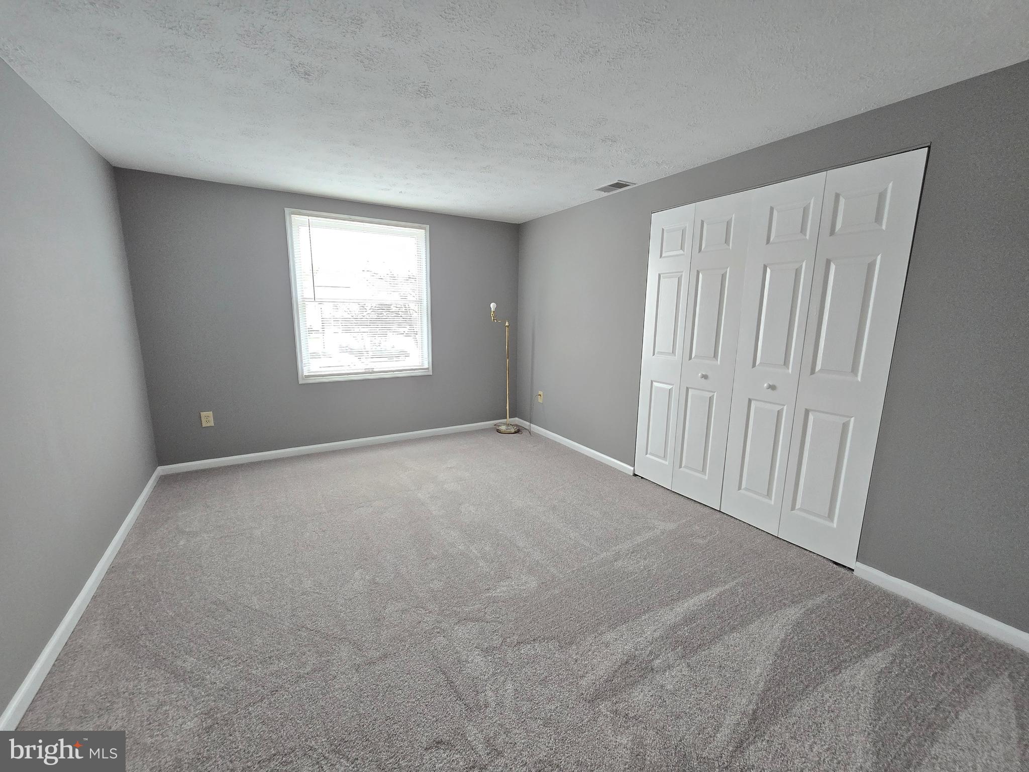 821 Stratford Way, Unit H Frederick, MD 21701 - Photo 36 of 45 a view of an empty room with a window
