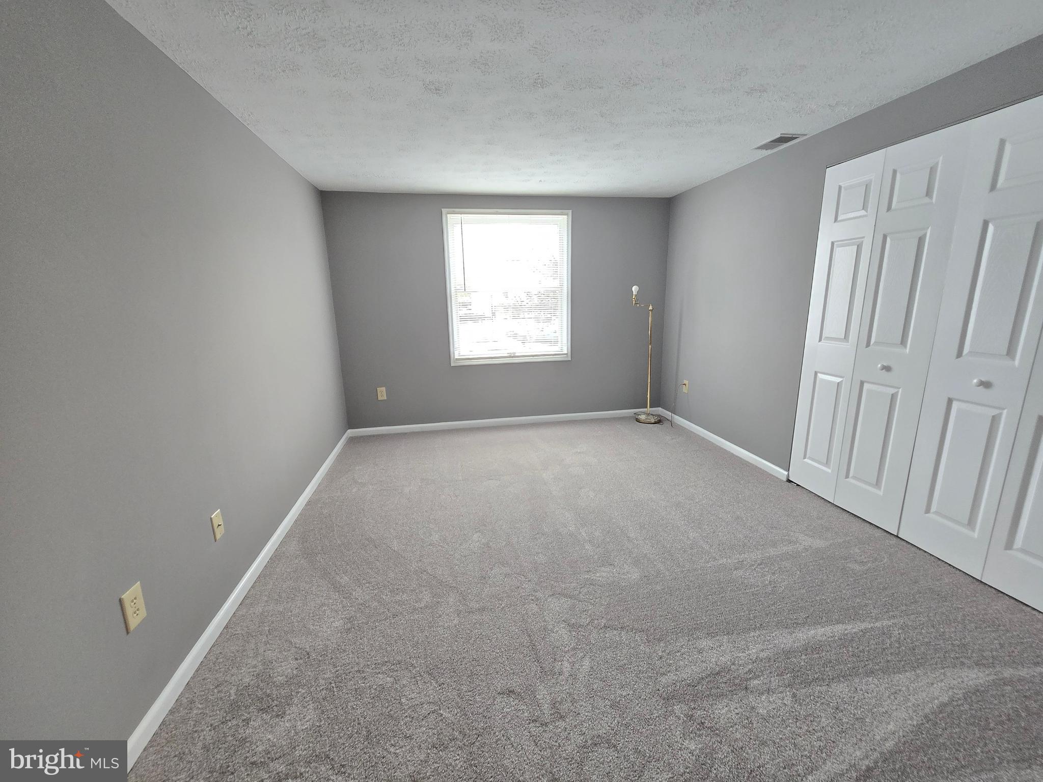 821 Stratford Way, Unit H Frederick, MD 21701 - Photo 37 of 45 a view of an empty room with a window