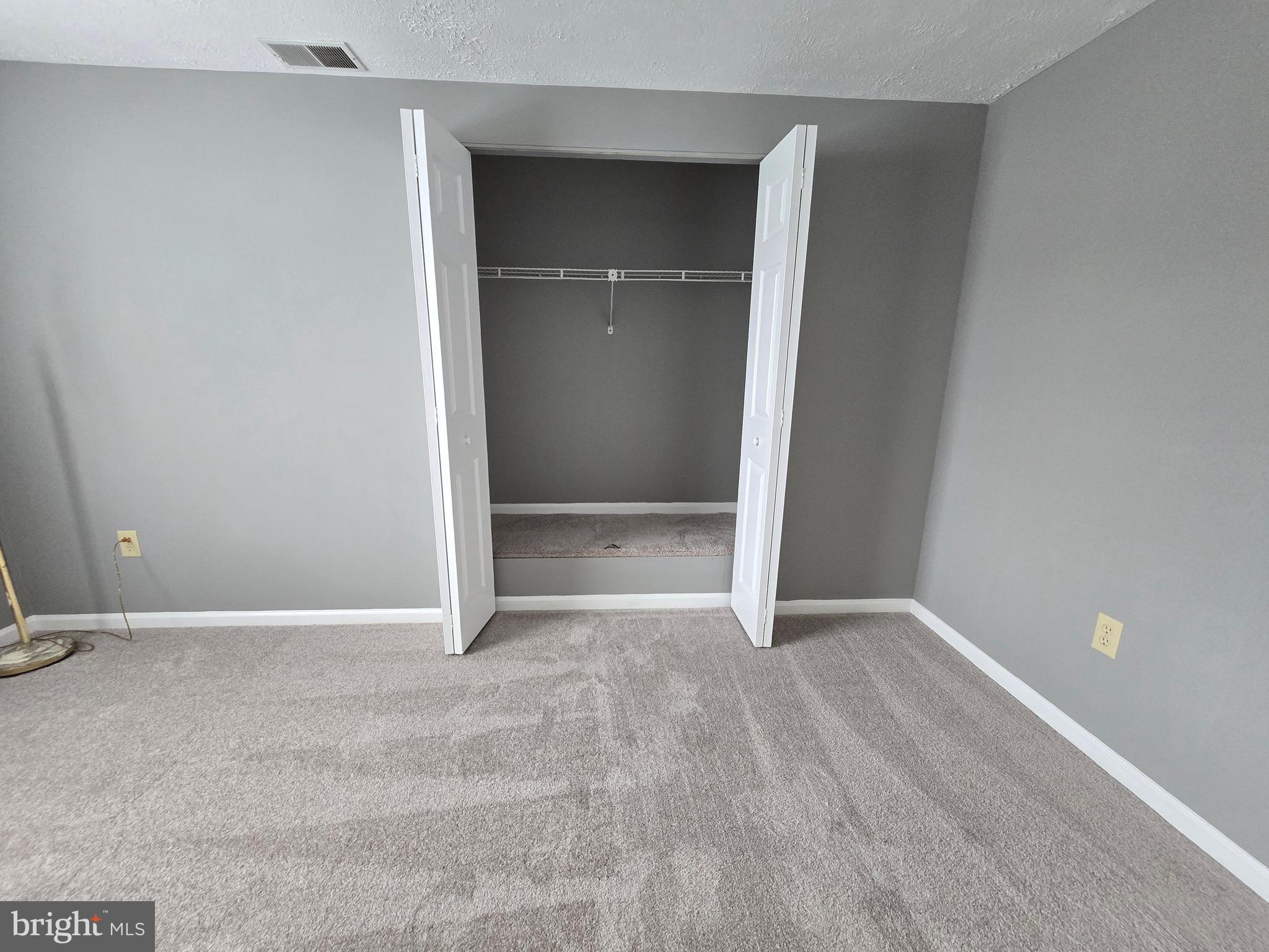 821 Stratford Way, Unit H Frederick, MD 21701 - Photo 38 of 45 an empty room with closet