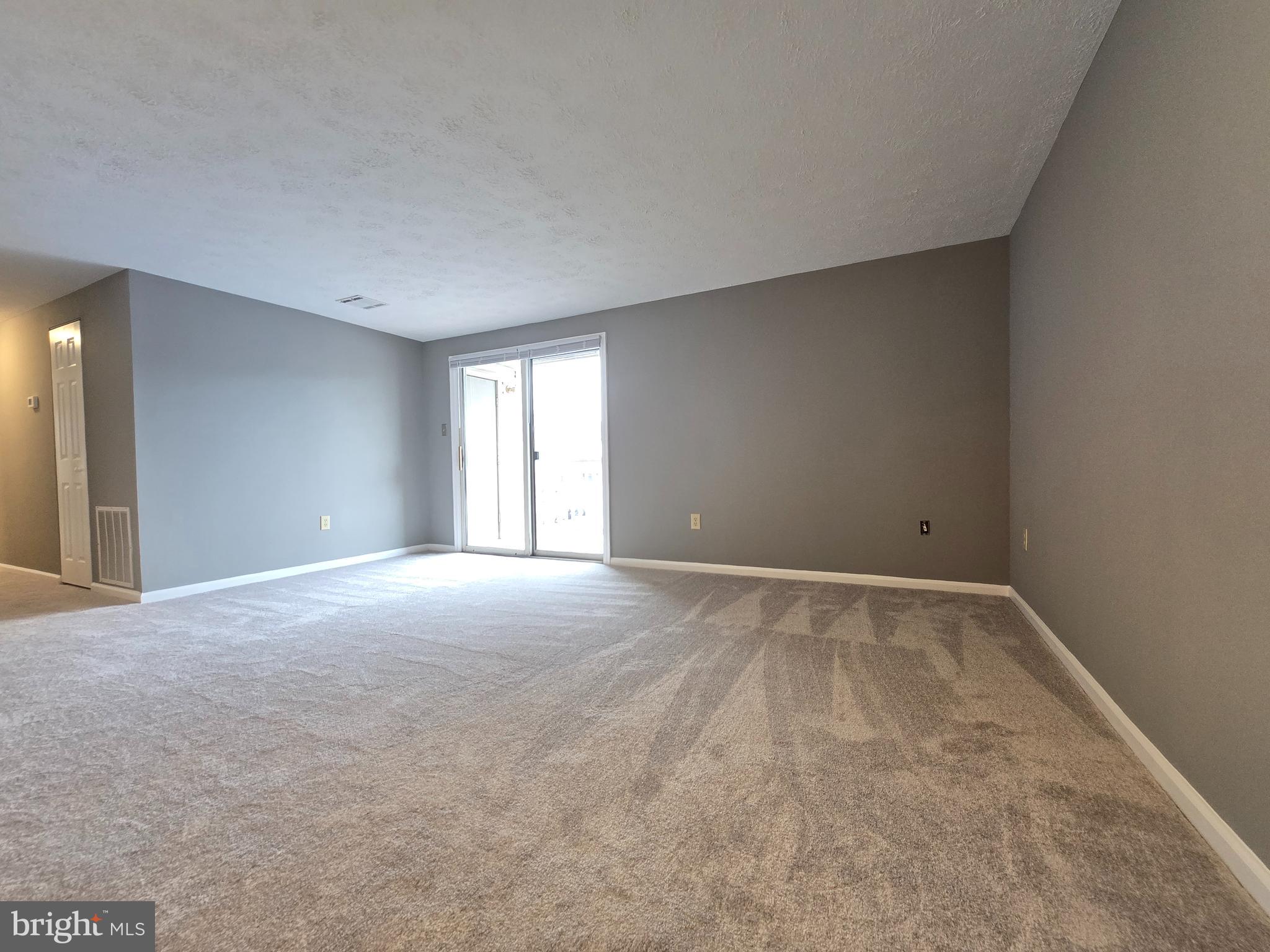 821 Stratford Way, Unit H Frederick, MD 21701 - Photo 5 of 45 a view of an empty room with a window