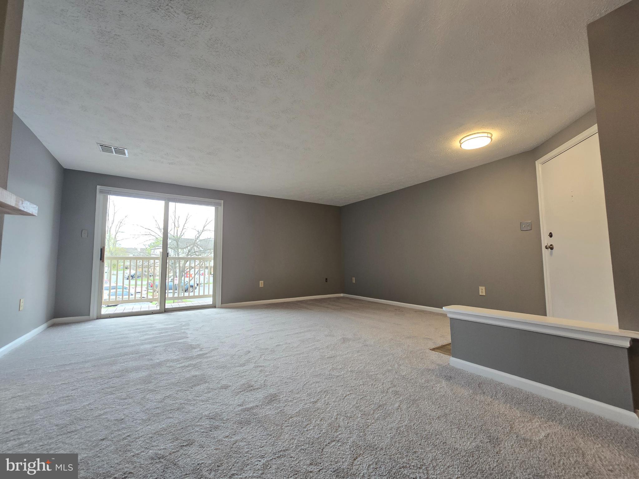 821 Stratford Way, Unit H Frederick, MD 21701 - Photo 6 of 45 a view of an empty room with a window