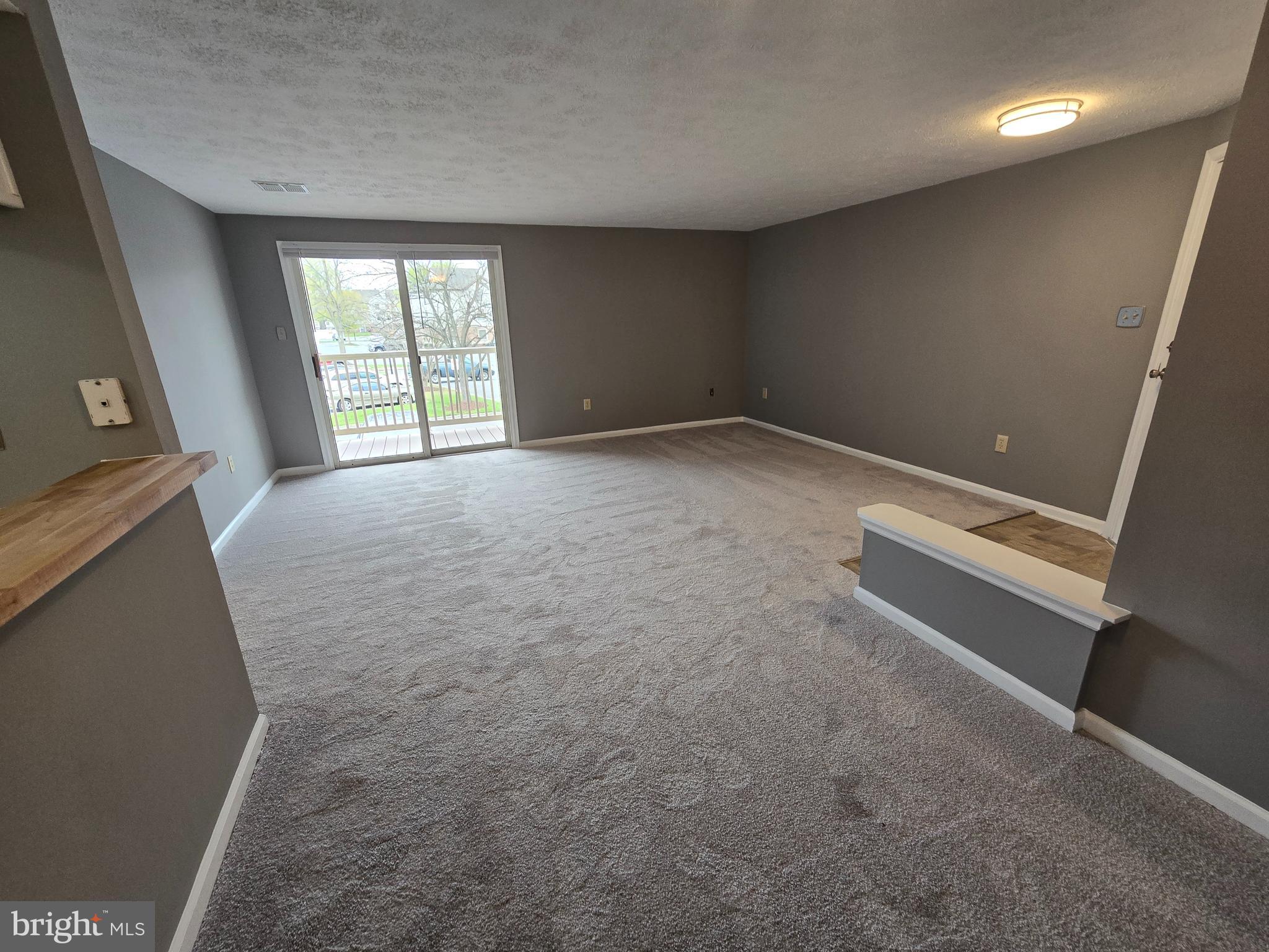821 Stratford Way, Unit H Frederick, MD 21701 - Photo 7 of 45 an empty room with windows