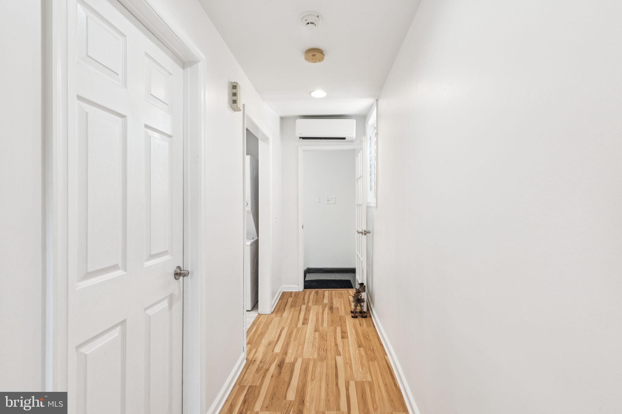 932 Locust Street Philadelphia, PA 19107 - Photo 20 of 23 a view of a hallway with wooden floor and entryway