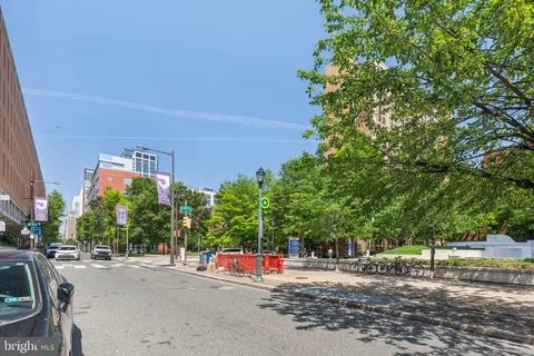 a view of a street with a building in the background