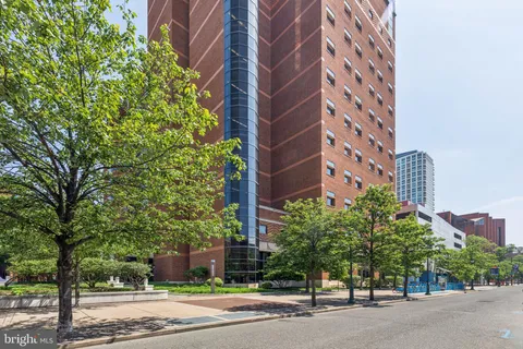 a tall building sitting next to a road