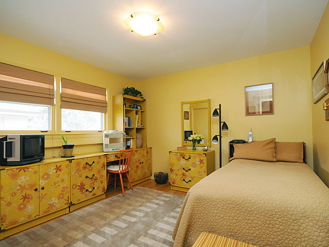 739 Juniper Road Glenview, IL 60025 - Photo 4 of 21 a bedroom with double bed and a large window