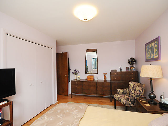 739 Juniper Road Glenview, IL 60025 - Photo 8 of 21 a bedroom with furniture and a flat screen tv