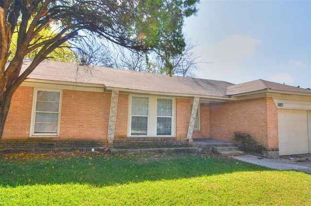 front view of a house with a yard