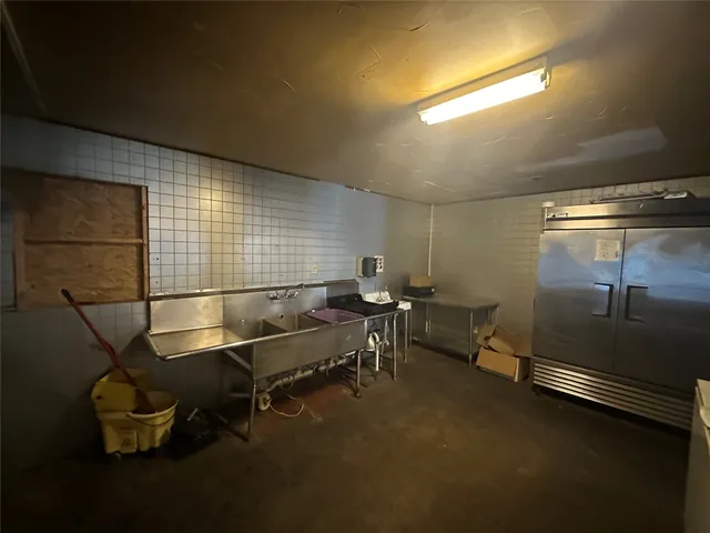 a living room with furniture a air conditioner vent and a window