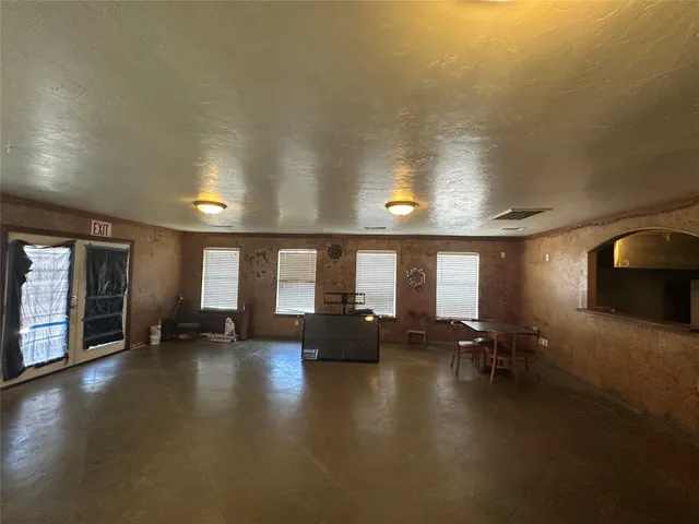 a view of a lobby with furniture and floor to ceiling window