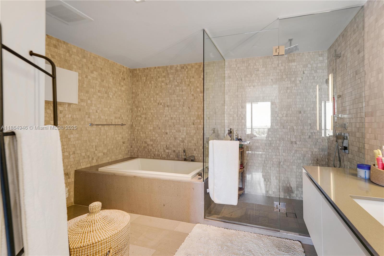 88 Southwest 7th Street, Unit 2910 Miami, FL 33130 - Photo 14 of 22 a bathroom with a sink a toilet and shower