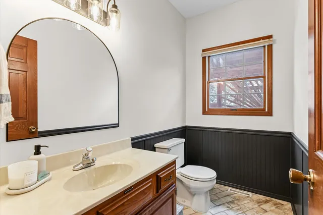 a view of a workspace with furniture and a flat screen tv